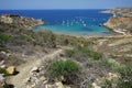 Magnificent views of Riviera Beach and the small watchtower Ghajn Tuffieha Tower, Mellieha, Malta. Royalty Free Stock Photo