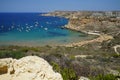 Magnificent views of Riviera Beach and the small watchtower Ghajn Tuffieha Tower, Mellieha, Malta. Royalty Free Stock Photo