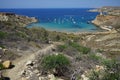 Magnificent views of Riviera Beach and the small watchtower Ghajn Tuffieha Tower, Mellieha, Malta. Royalty Free Stock Photo