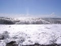 Magnificent wave with white foam in the sea on the shore of the ocean surf on the beach