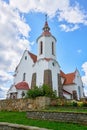 A magnificent white Church with a red roof. Old Catholic Church