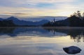 Magnificent wide-angle landscape view of famous Bled Lake with mountain range in the background Royalty Free Stock Photo