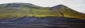 Magnificent volcanic scenery on the road to Landmannalaugar, Iceland. Black volcanic ash covered by green mosses Royalty Free Stock Photo