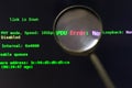 The magnifier is on a black background with green text. Software testing. The concept of finding errors in computer programs