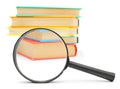 Magnifier and books. Royalty Free Stock Photo