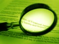 Magnifier and financial documents Royalty Free Stock Photo