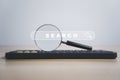 Magnifier glass on computer keyboard with search engine bar website on the table for searching information from internet , cloud Royalty Free Stock Photo