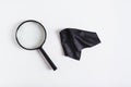 Magnifier for magnification in black plastic frame and cleaning cloth on blue background top view Royalty Free Stock Photo