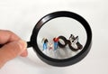 Magnifier and miniature people. The concept of people`s narrow view of same-sex couples` families.