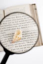 magnifier and old book