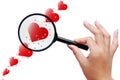 Magnifier and red hearts