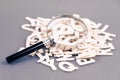Magnifying Glass and Alphabets Royalty Free Stock Photo
