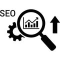 A magnifying glass with a bar chart inside it representing SEO growth and optimization with gears and an upward arrow Royalty Free Stock Photo