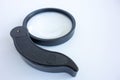 Magnifying glass with black handle on white isolate Royalty Free Stock Photo