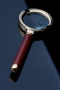 Magnifying glass on black table