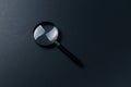 Magnifying glass on black texture background