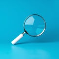 Magnifying glass on blue background SEO search engine optimization concept Royalty Free Stock Photo