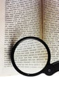 Magnifying Glass On Book Royalty Free Stock Photo