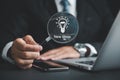 Magnifying glass in businessman's hand reveals light bulb Royalty Free Stock Photo