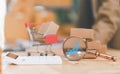 magnifying glass, calculator, shopping cart on table, business growth report check concept, online store order management,