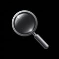 A magnifying glass is centered against a black background. It features a metallic gray Royalty Free Stock Photo