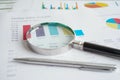 Magnifying glass on charts graphs paper. Financial development, Banking Account, Statistics, Investment Analytic research data Royalty Free Stock Photo