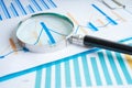 Magnifying glass on charts graphs paper. Financial development, Banking Account, Statistics, Investment Analytic research data Royalty Free Stock Photo