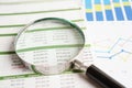 Magnifying glass on charts graphs paper. Financial development, Banking Account, Statistics, Investment Analytic research data Royalty Free Stock Photo