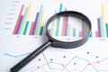 Magnifying glass on charts graphs paper. Financial development, Banking Account, Statistics, Investment Analytic research data Royalty Free Stock Photo