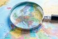 Magnifying glass on europe world globe map