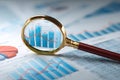 Financial Data Analysis with Magnifying Glass Royalty Free Stock Photo