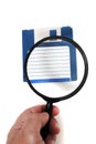 magnifying glass on floppy disk Royalty Free Stock Photo