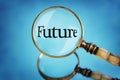 Magnifying glass focus on the word future