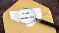 A magnifying glass focuses on the words 'secure sockets layer' printed on a piece of paper placed inside an