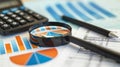 The magnifying glass and graphs.AI generated image Royalty Free Stock Photo