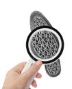 Magnifying glass in hand and shoe printout Royalty Free Stock Photo