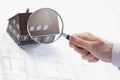 Magnifying glass and house. Royalty Free Stock Photo