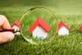 Magnifying Glass Inspecting A Model House Royalty Free Stock Photo