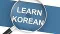 Magnifying glass with learn korean word
