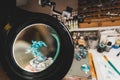 Magnifying glass lens view of miniature painting progress