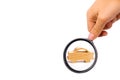 Magnifying glass is looking at the Wooden figurine of a car on a white background. Minimalism. The concept of car insurance, buyin Royalty Free Stock Photo