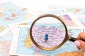 Magnifying glass on a map - close-up Royalty Free Stock Photo