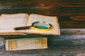 Magnifying glass on old open book Royalty Free Stock Photo