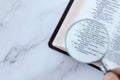 Magnifying glass over open holy buble book of psalms 139 verses, top view, searcing Scriptures concept Royalty Free Stock Photo