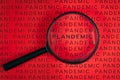 Magnifying glass over word `Plandemic` between lines wird word `Pandemic` Royalty Free Stock Photo