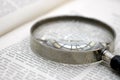 Magnifying glass on page Royalty Free Stock Photo