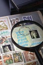 Magnifying glass on a postage stamp