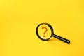 Magnifying glass and question mark. FAQ.