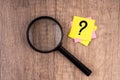 Magnifying glass and question mark symbol Royalty Free Stock Photo
