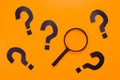 Magnifying Glass and Question Marks Royalty Free Stock Photo